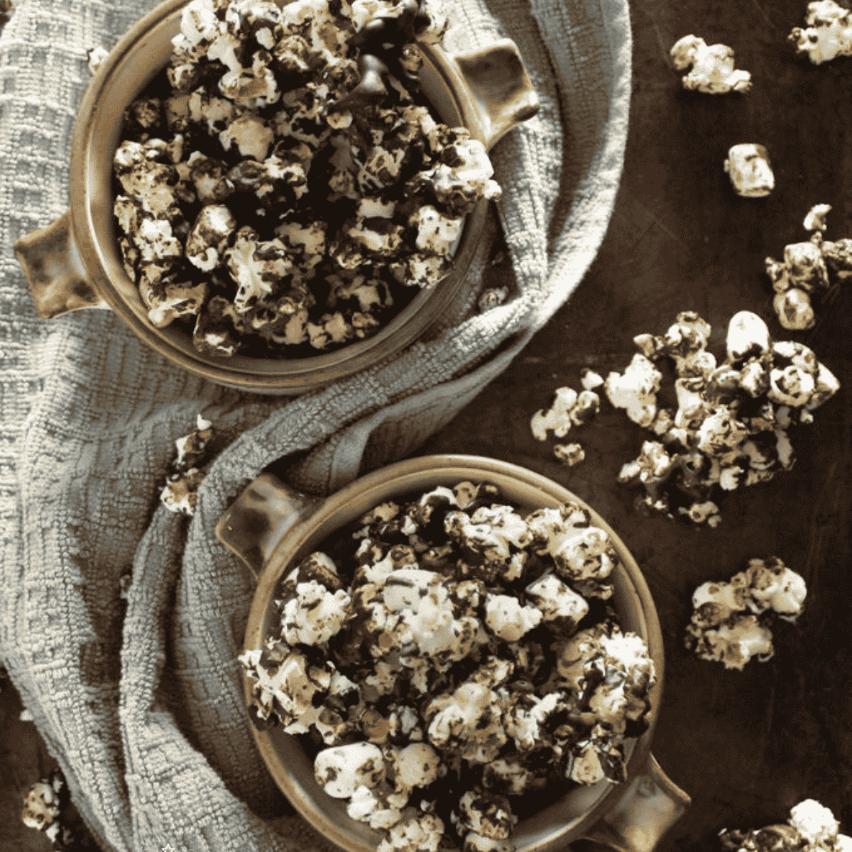 Chocolate-drizzled popcorn with Sel Magique Spicy Blend in warm light